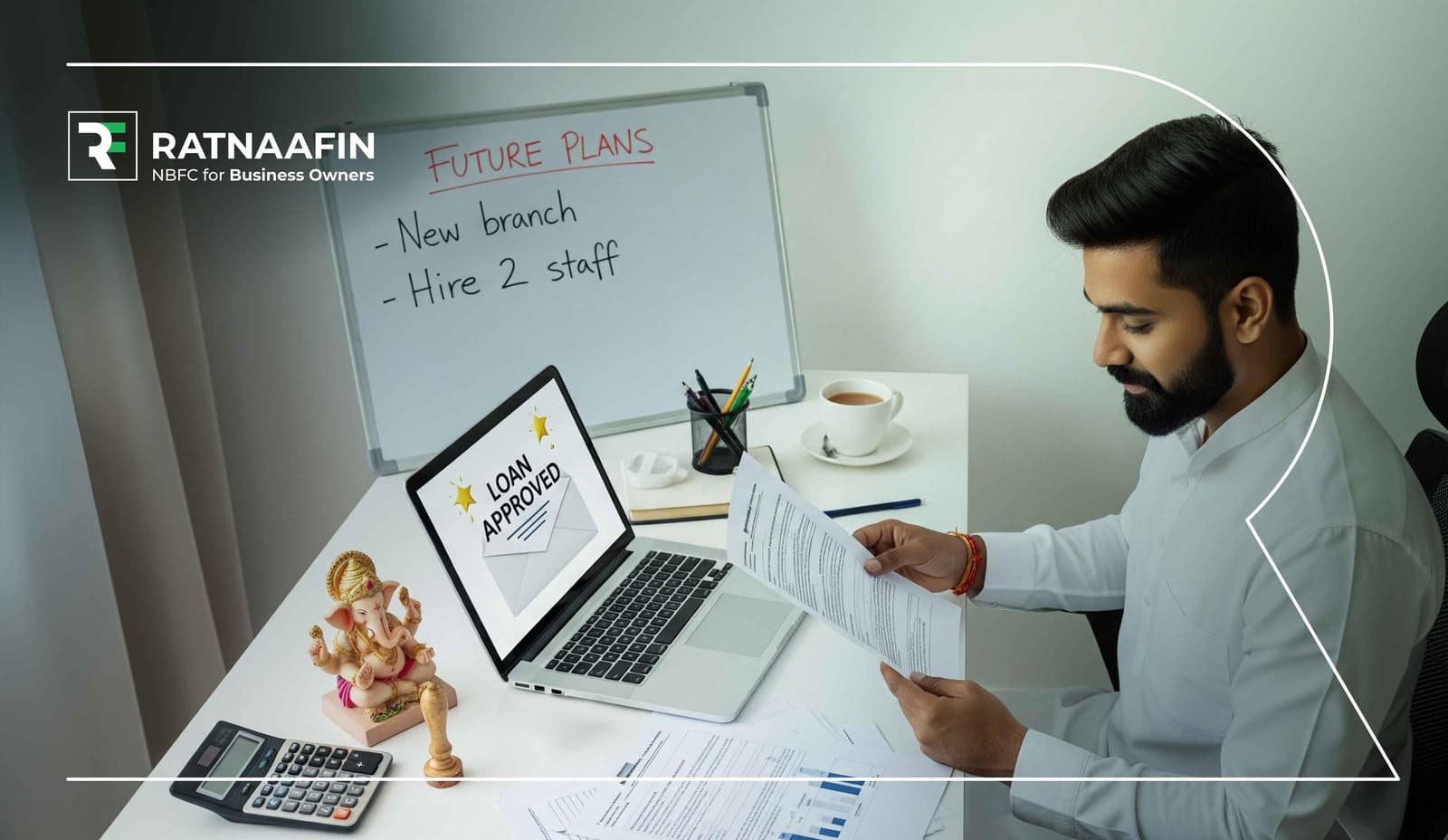 A young businessman in a white shirt reviews loan documents at a desk, with a laptop displaying 'Loan Approved', a whiteboard behind him showing future business plans to open a new branch and hire two staff, and a Ganesh idol, calculator, and cup of tea on the table — branded with 'Ratnaafin, NBFC for Business Owners